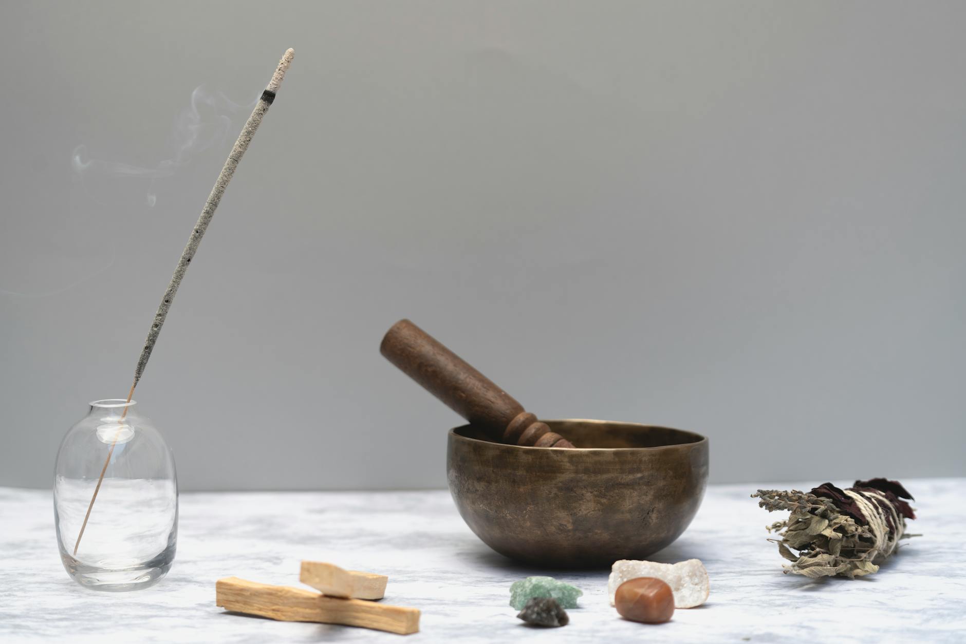 burning incense on a glass bottle